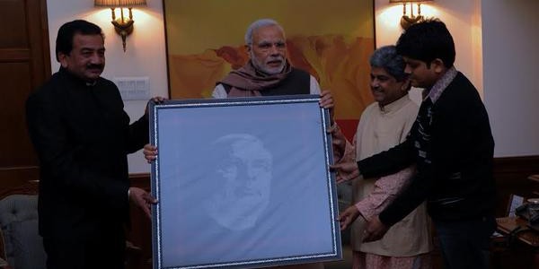 UNESCO awardee Surendra Meher from Odisha presents IKAT weaving to Prime minister