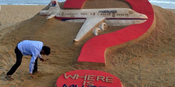 Where is MH370 Malaysian Flight? Asks Sudarshan via sandart in Puri beach